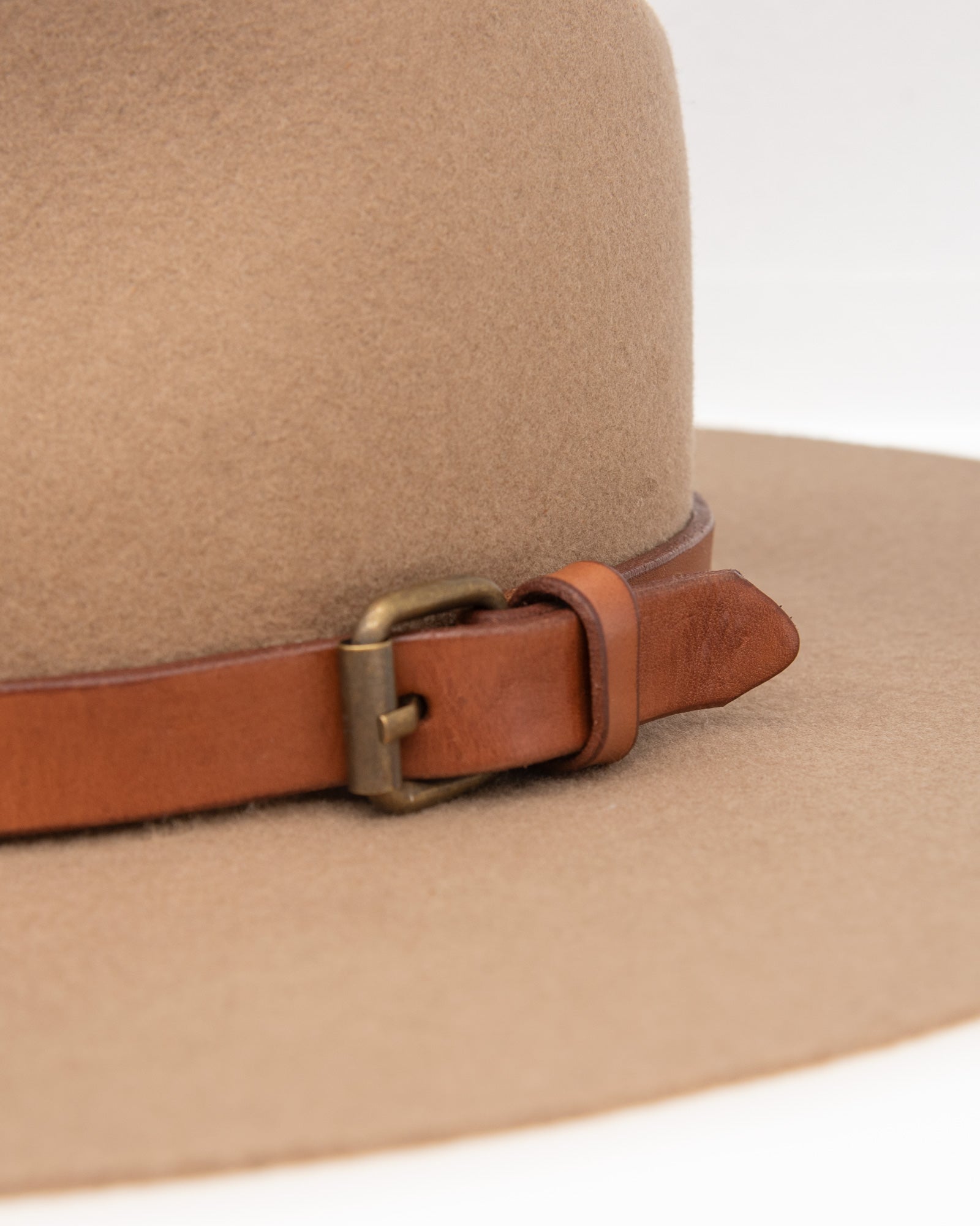 Ninakuru long brim wool hat with leather band and buckle.
