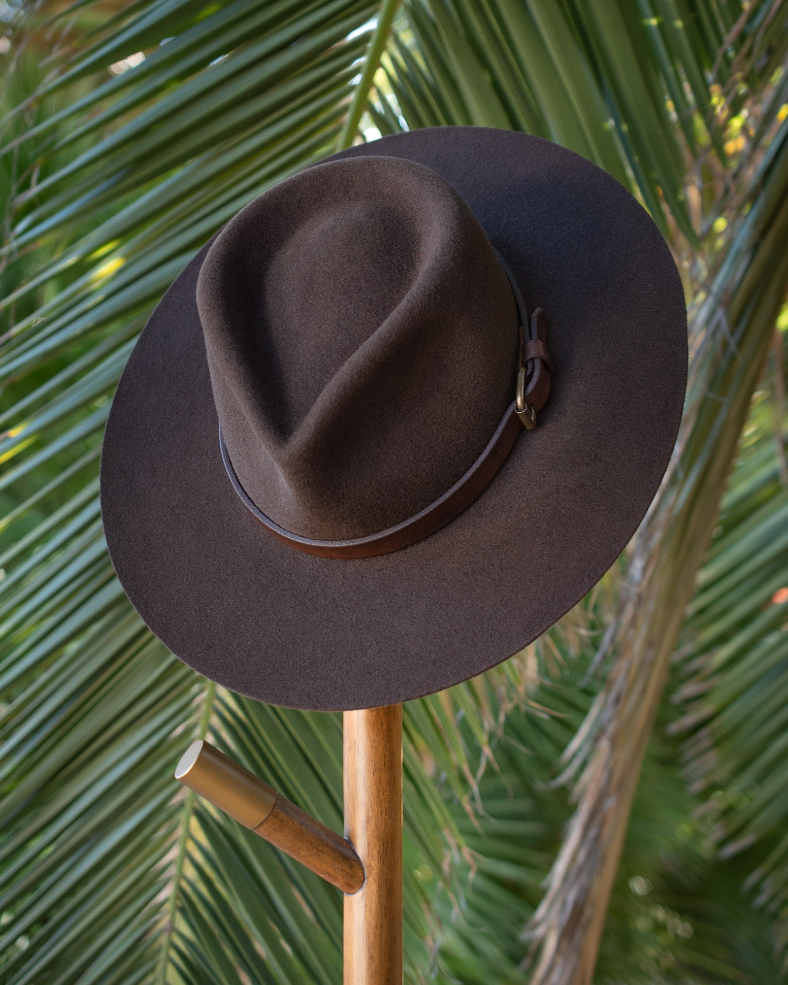 Ninakuru long brim wool hat with leather band and buckle.