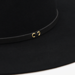 Ninakuru long brim wool hat with black leather band and eyelets. Leather interior band.