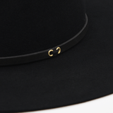 Ninakuru long brim wool hat with black leather band and eyelets. Leather interior band.