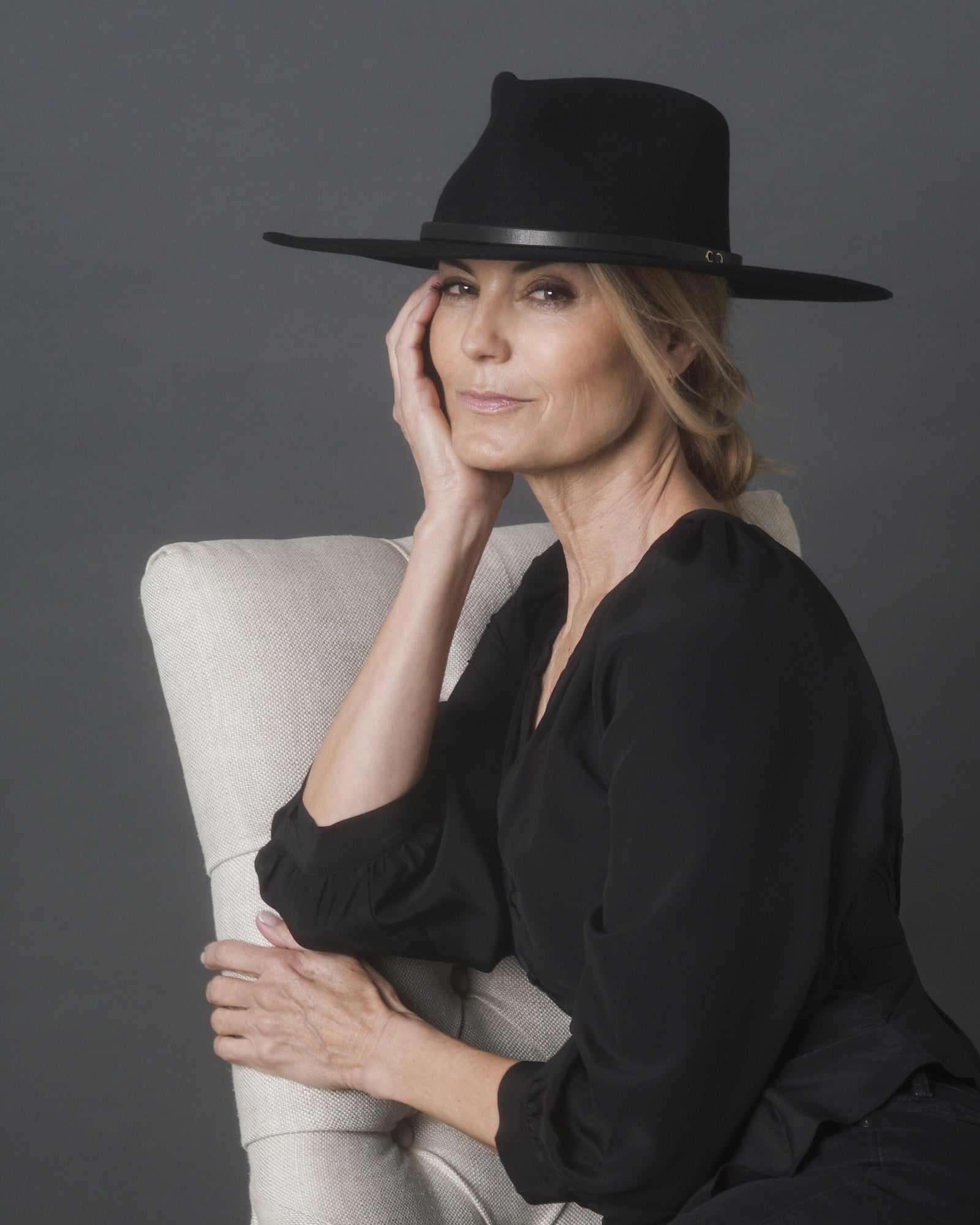 Ninakuru long brim wool hat with black leather band and eyelets. Leather interior band.