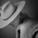 Ninakuru long brim wool hat with black leather band and eyelets. Leather interior band.