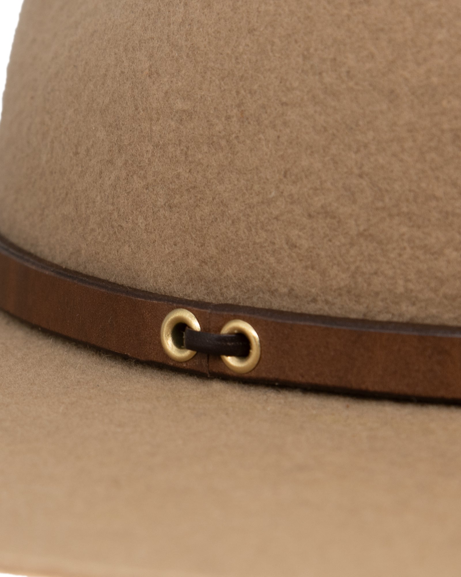 Ninakuru long brim wool hat with brown leather band and eyelets. Leather interior band.