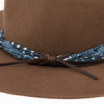 Ninakuru wool hat with cotton wrap band and leather lace.