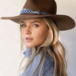 Ninakuru wool hat with cotton wrap band and leather lace.