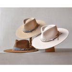 Ninakuru wool hat with cotton wrap band and leather lace.