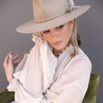 Ninakuru wool hat with braided leather and game feather.