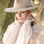 Ninakuru wool hat with braided leather and game feather.