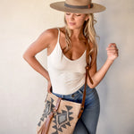 Ninakuru wool hat with vegan band and brass loops.