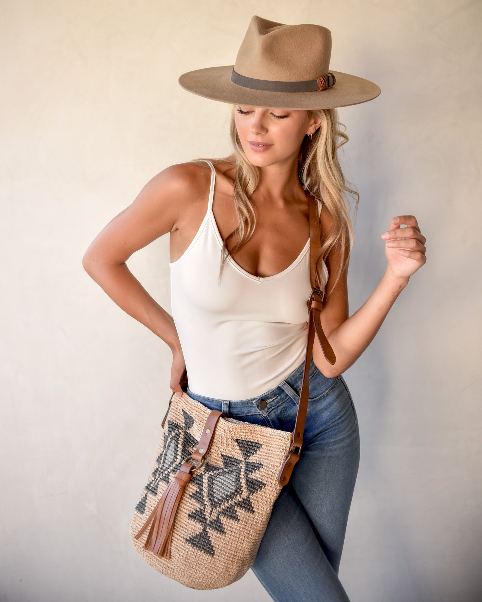 Ninakuru wool hat with vegan band and brass loops.