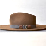 Ninakuru wool hat with vegan band and brass loops.