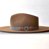 Ninakuru wool hat with vegan band and brass loops.