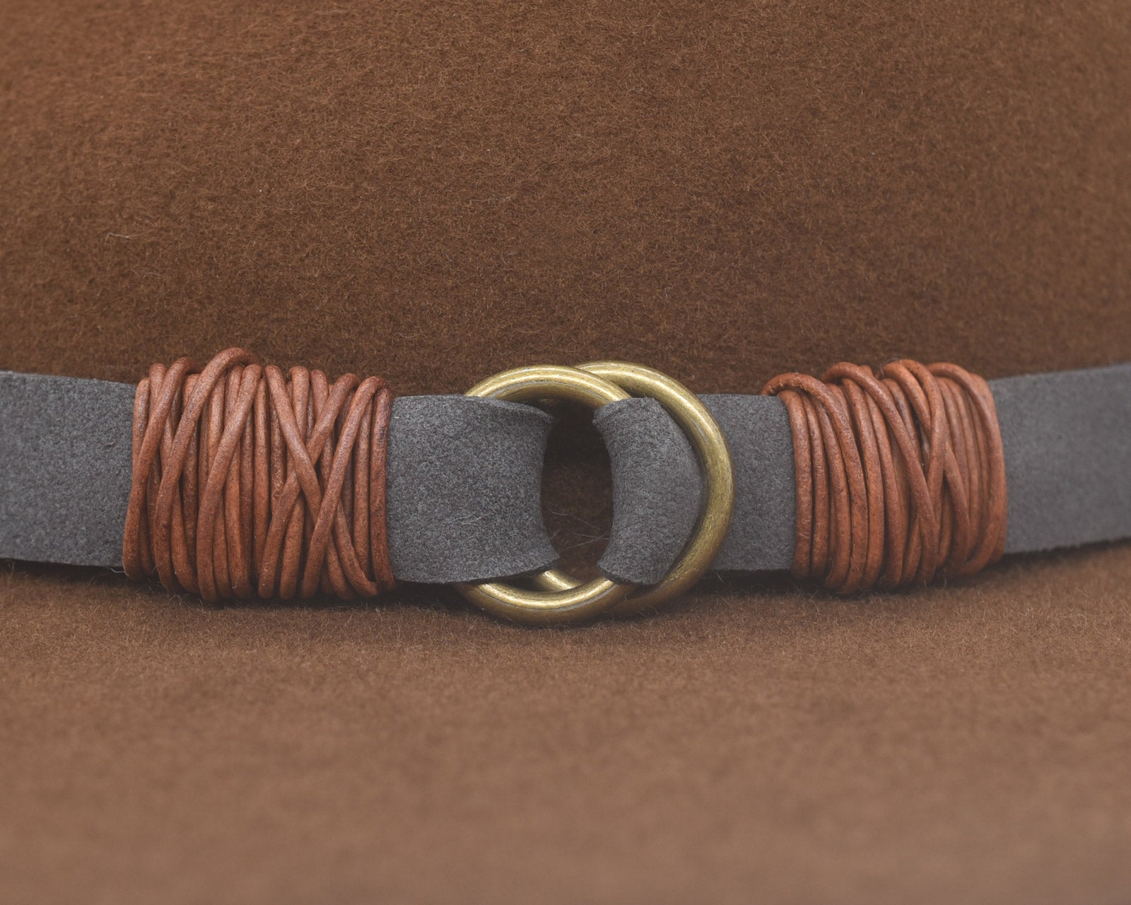 Ninakuru wool hat with vegan band and brass loops.