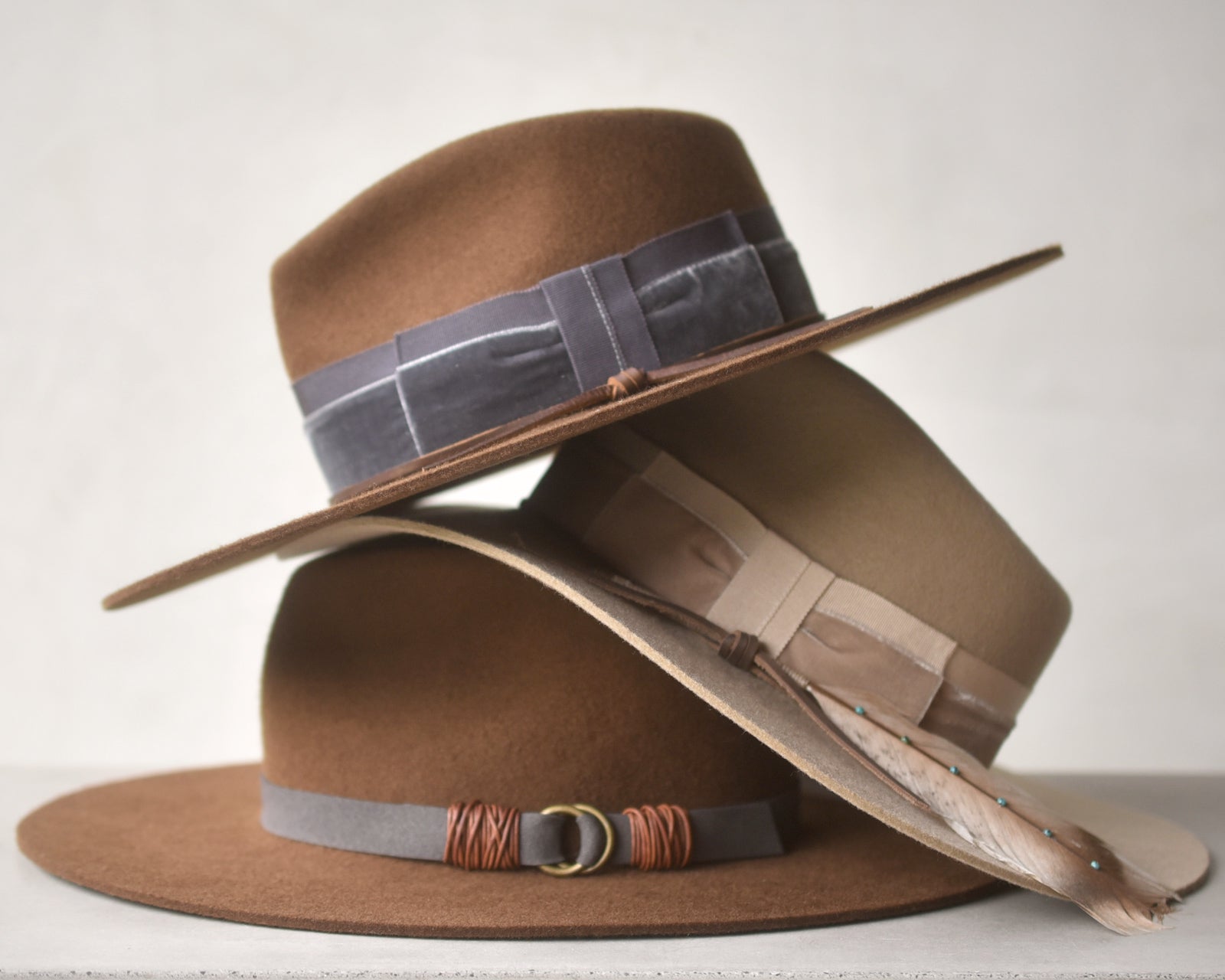 Ninakuru wool hat with vegan band and brass loops.