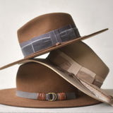 Ninakuru wool hat with vegan band and brass loops.