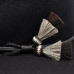 Ninakuru long brim wool hat with leather band and horsehair tassels.