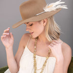 Ninakuru wool hat with game feathers and turquoise.