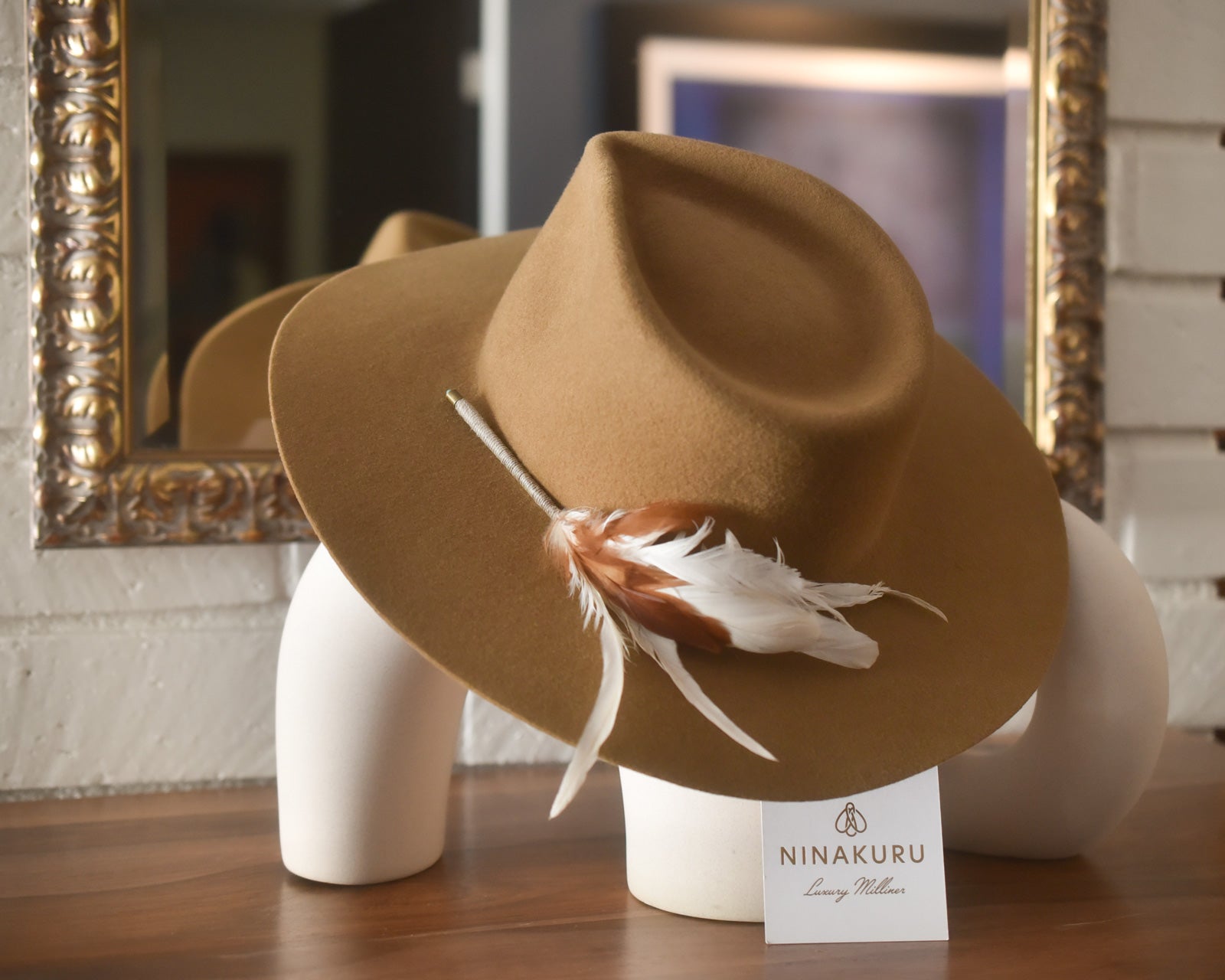 Ninakuru wool hat with game feathers and turquoise.