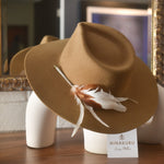 Ninakuru wool hat with game feathers and turquoise.