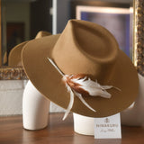 Ninakuru wool hat with game feathers and turquoise.