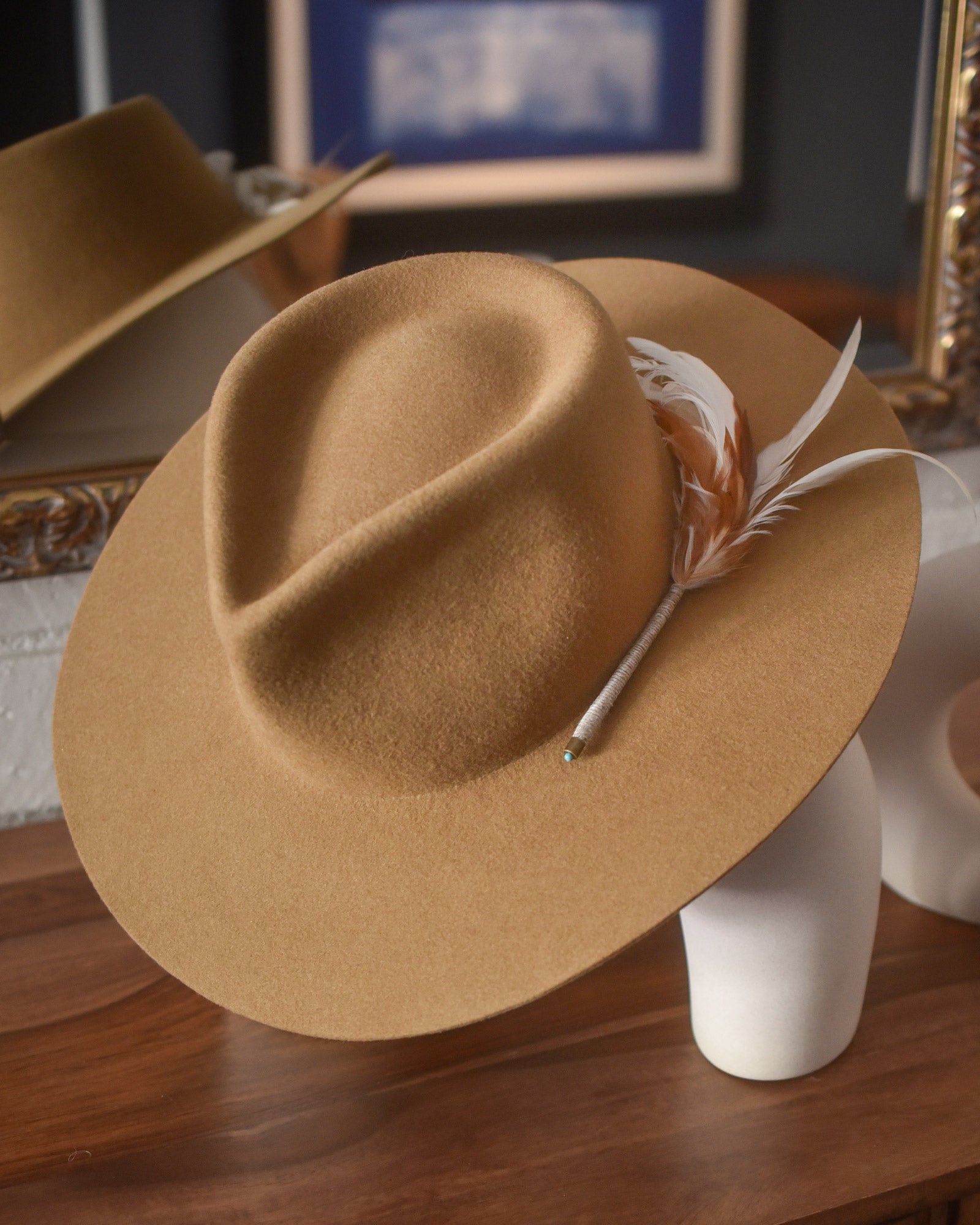 Ninakuru wool hat with game feathers and turquoise.