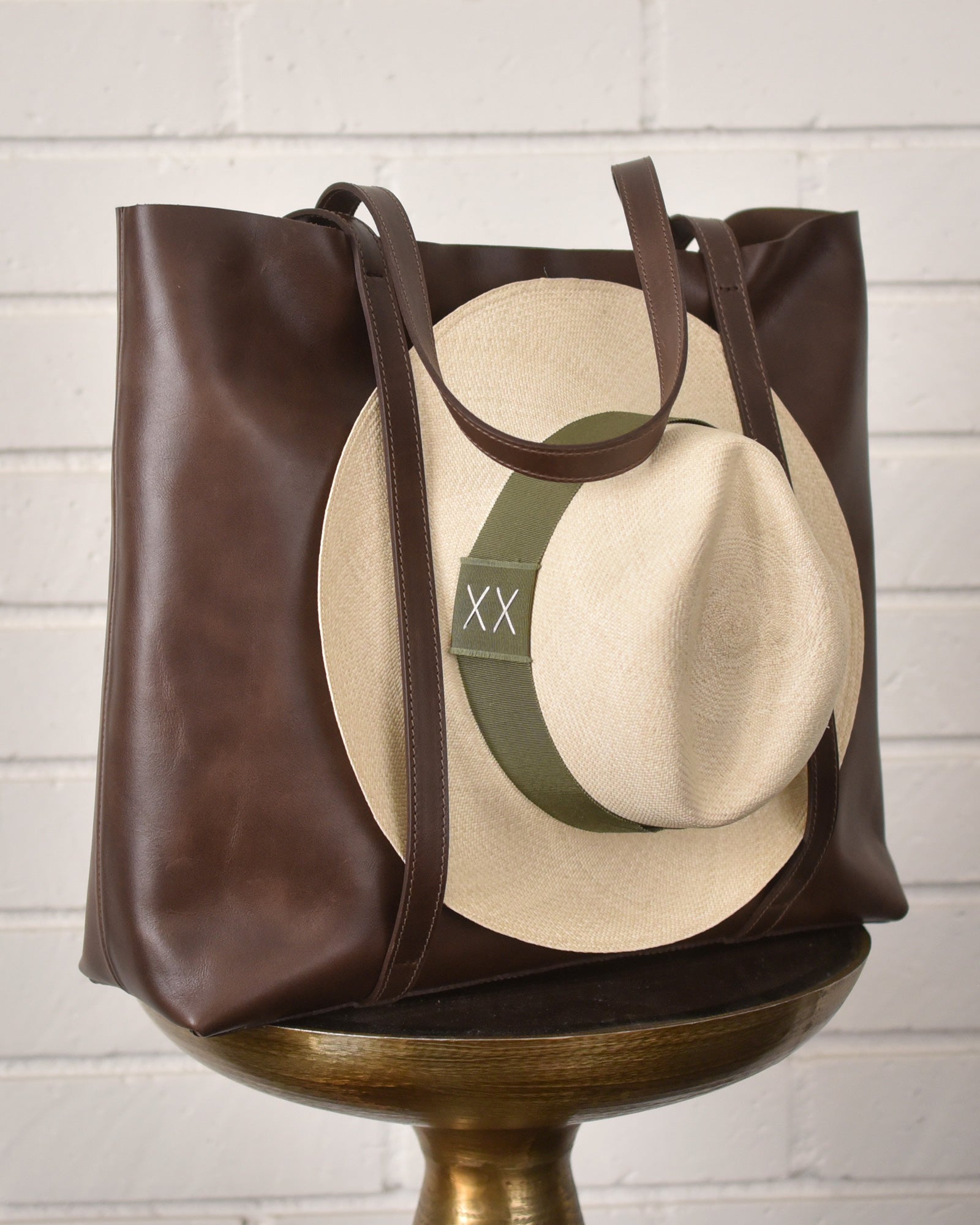 Leather tote bag with hat carrier.