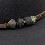 Ninakuru wool felt hat with leather and labradorite.