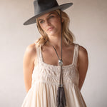 Ninakuru wool felt hat with leather and labradorite.