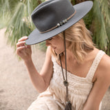 Ninakuru wool felt hat with leather and labradorite.