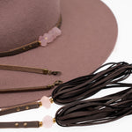 Ninakuru wool felt hat with leather and pink quartz.