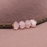 Ninakuru wool felt hat with leather and pink quartz.