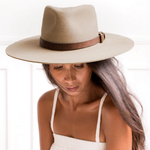 Ninakuru long brim wool hat with leather band and buckle. Leather interior band.