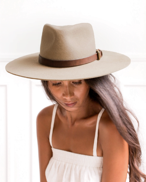 Ninakuru long brim wool hat with leather band and buckle. Leather interior band.