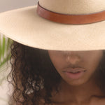 Ninakuru long brim Panama hat with leather band and buckle.
