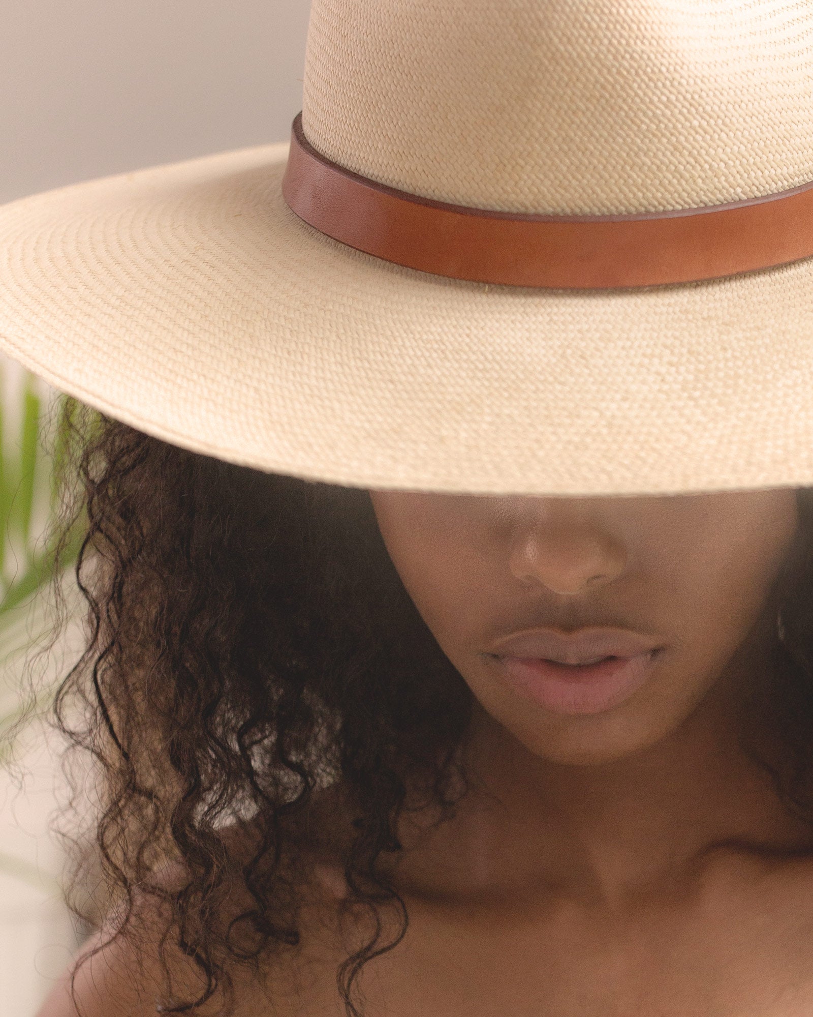 Ninakuru long brim Panama hat with leather band and buckle.
