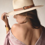 Ninakuru long brim Panama hat with leather band and buckle.