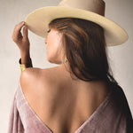 Ninakuru long brim Panama hat with leather band and buckle.