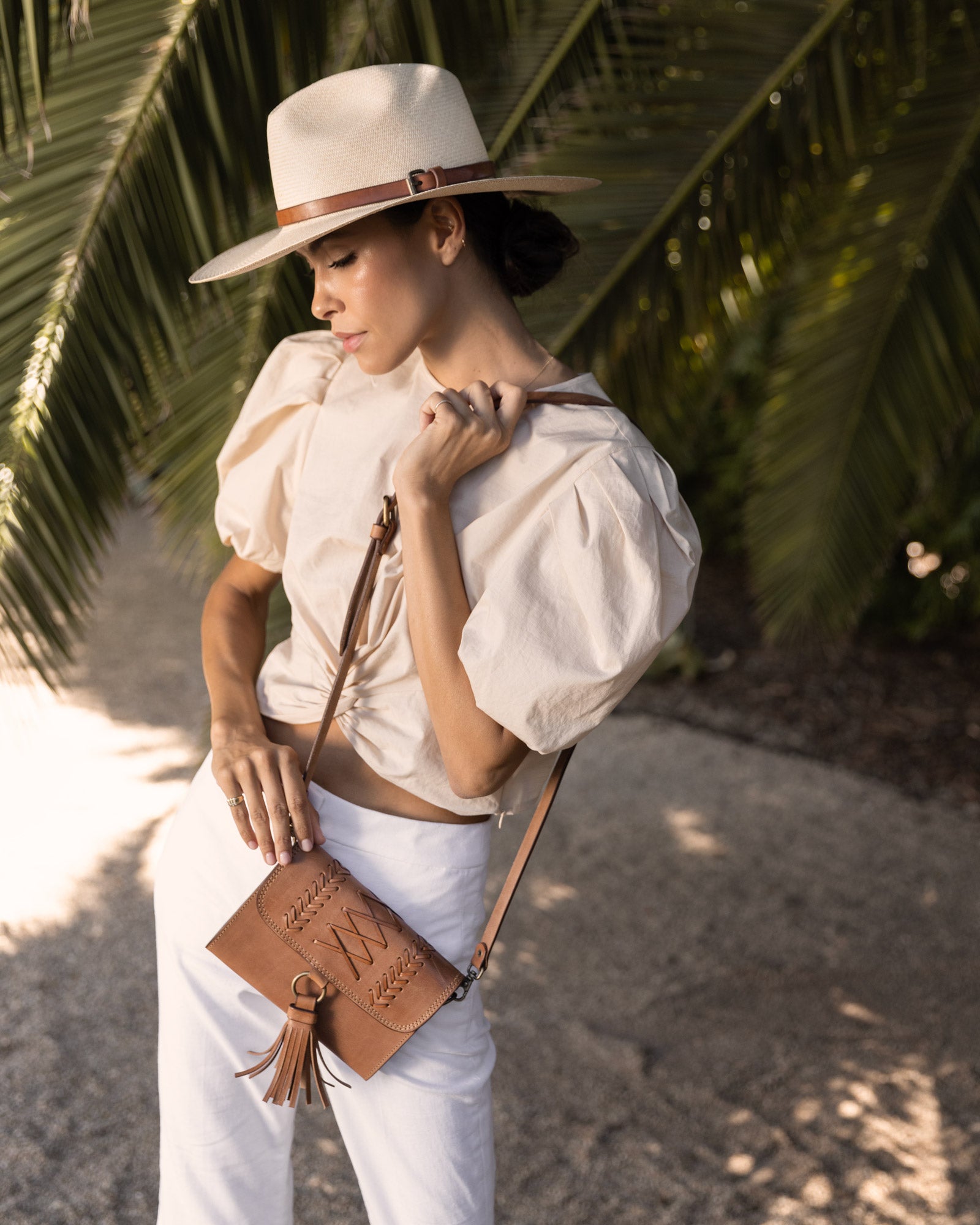 Ninakuru long brim Panama hat with leather band and buckle.
