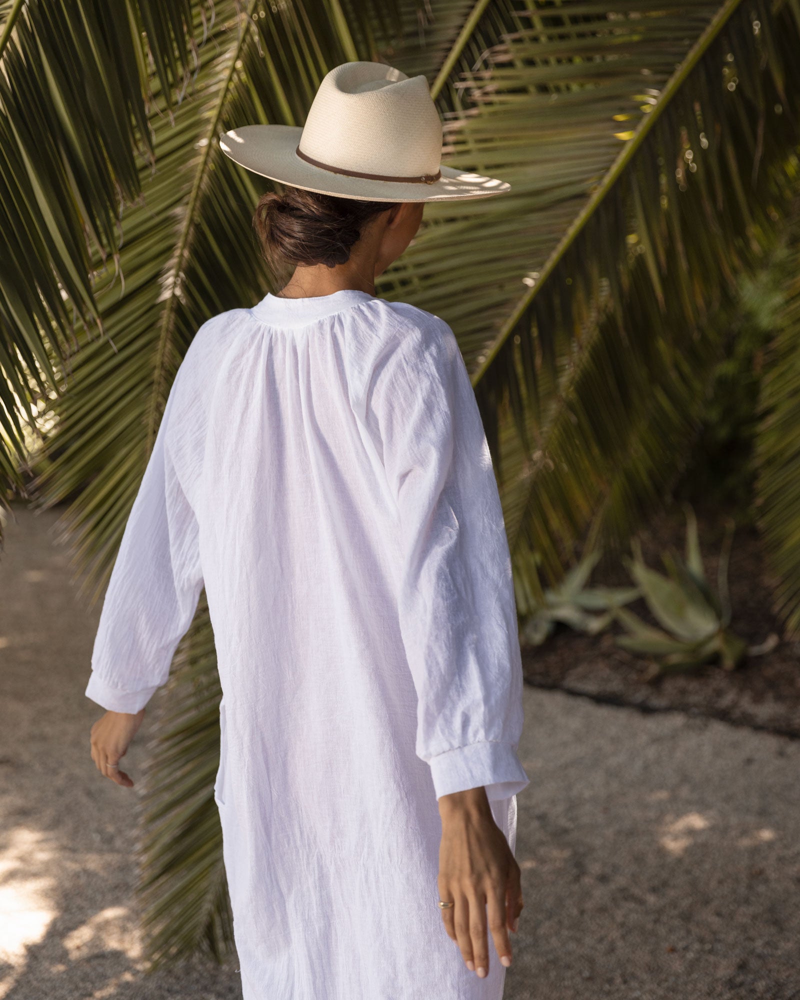 Ninakuru long brim Panama hat with leather lace band and bronze loop. Cotton interior band.