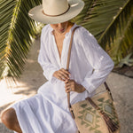 Ninakuru long brim Panama hat with leather lace band and bronze loop. Cotton interior band.