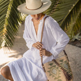 Ninakuru long brim Panama hat with leather lace band and bronze loop. Cotton interior band.