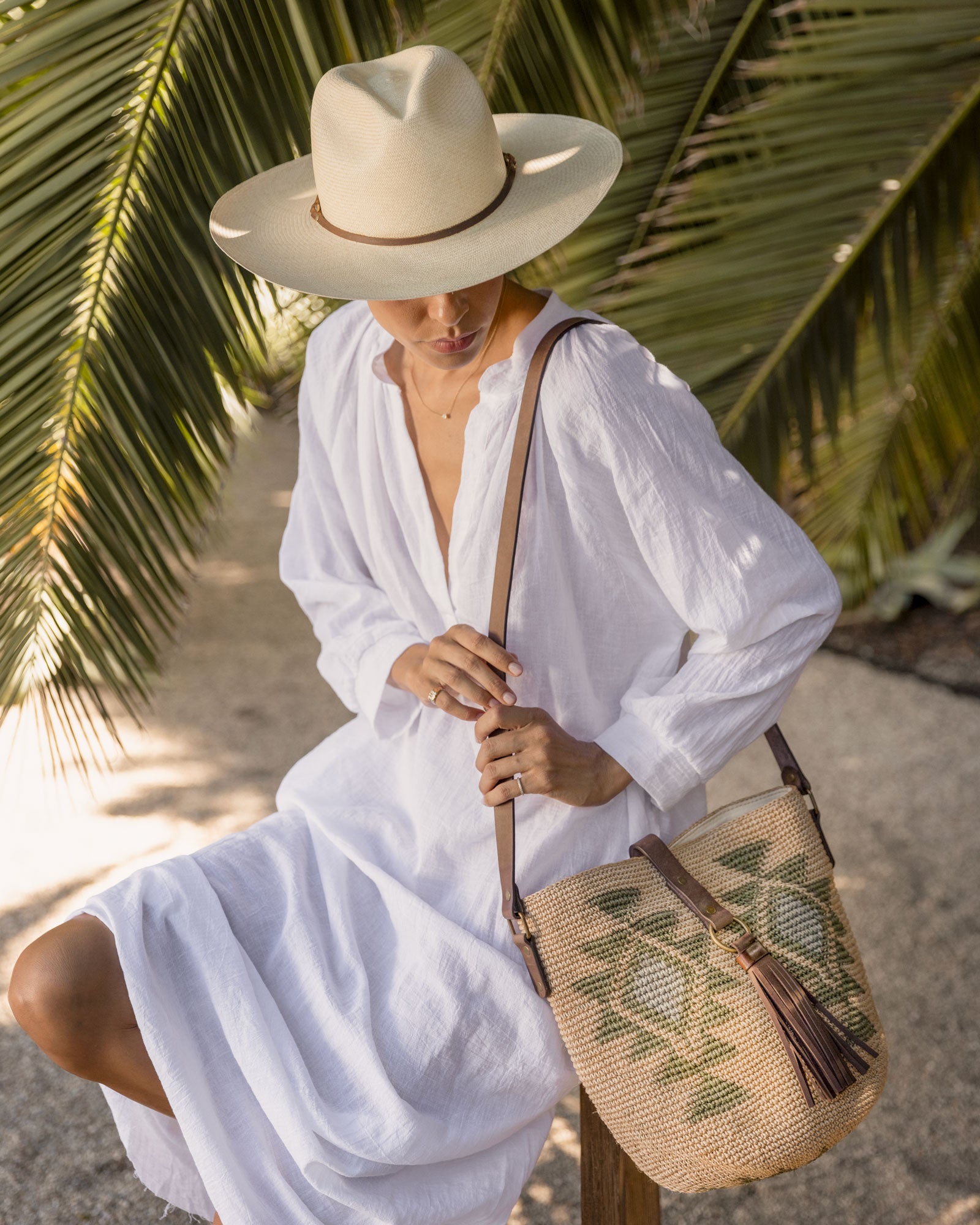 Ninakuru long brim Panama hat with leather lace band and bronze loop. Cotton interior band.