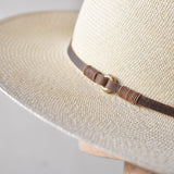 Ninakuru long brim Panama hat with leather lace band and bronze loop.