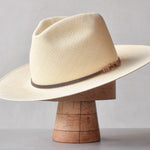 Ninakuru long brim Panama hat with leather lace band and bronze loop.