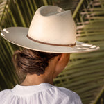 Ninakuru long brim Panama hat with leather lace band and bronze loop.