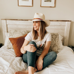 Ninakuru long brim Panama hat with tan leather embellished band, line stitch. Cotton interior band.