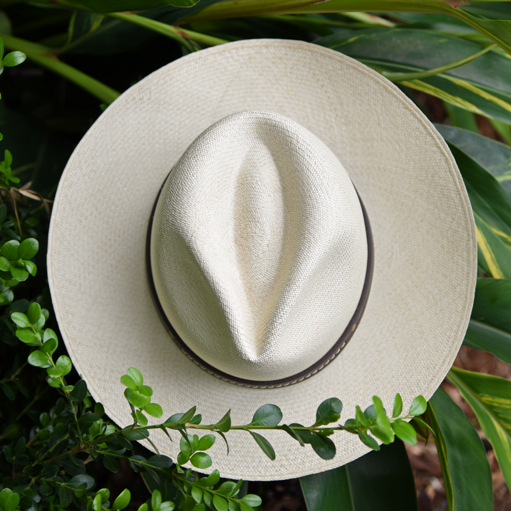 Ninakuru long brim Panama hat with dark brown leather embellished band, line stitch. Cotton interior band.