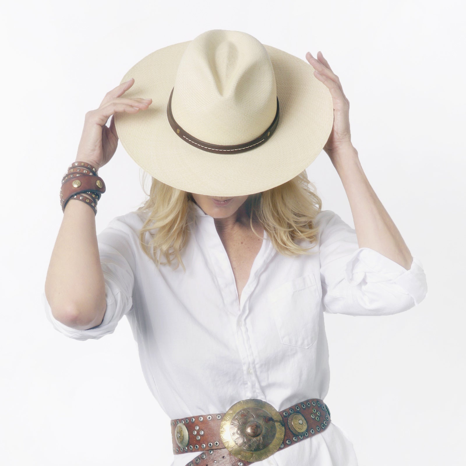Ninakuru long brim Panama hat with leather embellished band, line stitch.