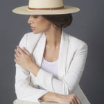 Ninakuru long brim Panama hat with leather band and brass eyelets.