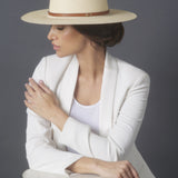Ninakuru long brim Panama hat with leather band and brass eyelets.